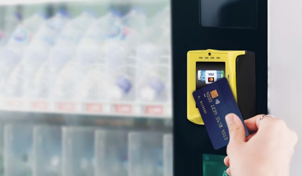 paying at a vending machine with a credit card